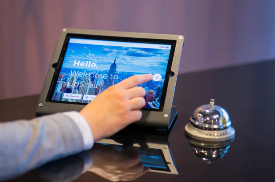 person about to touch black Android tablet computer photo
